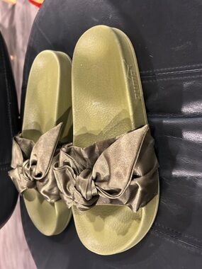 women's PUMA Fenty Bow Slides in olive green